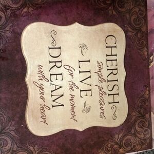 Wall hanging by New view. Cherish, Live, Dream.